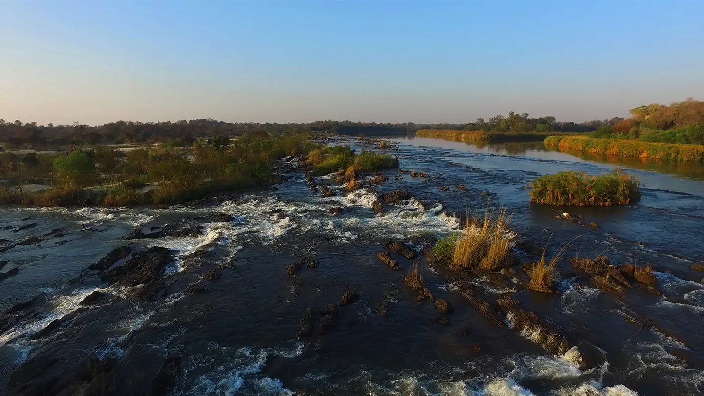 The rapids of Popa Falls in the late afternoon light